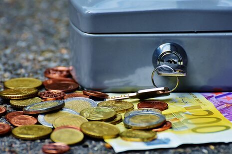 Cash box with euro coins and bills